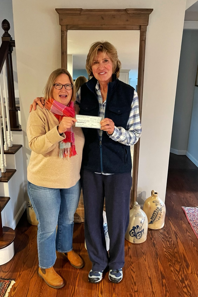 Margie from the Green Mountain Girls presents a check to Meg, our mentor!